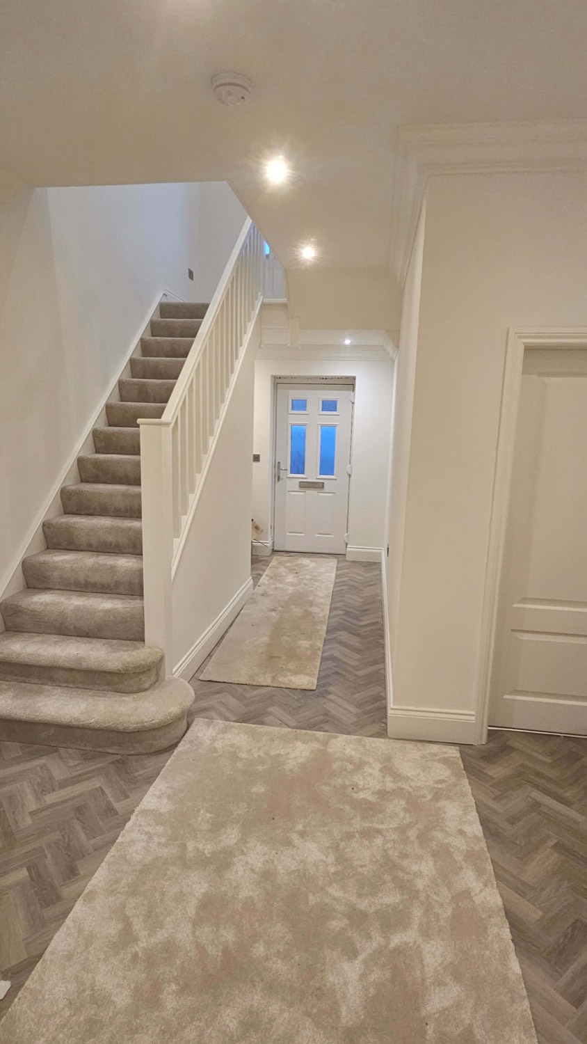Hallway and staircase by Complete Construction NE Limited