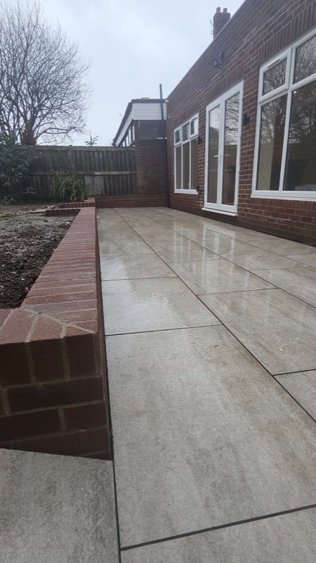 Patio and retaining wall by Complete Construction NE Limited